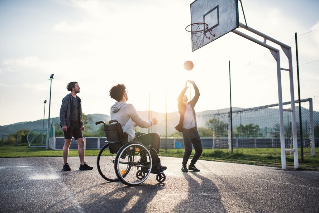 Disabled and Yongster Playing Basketball